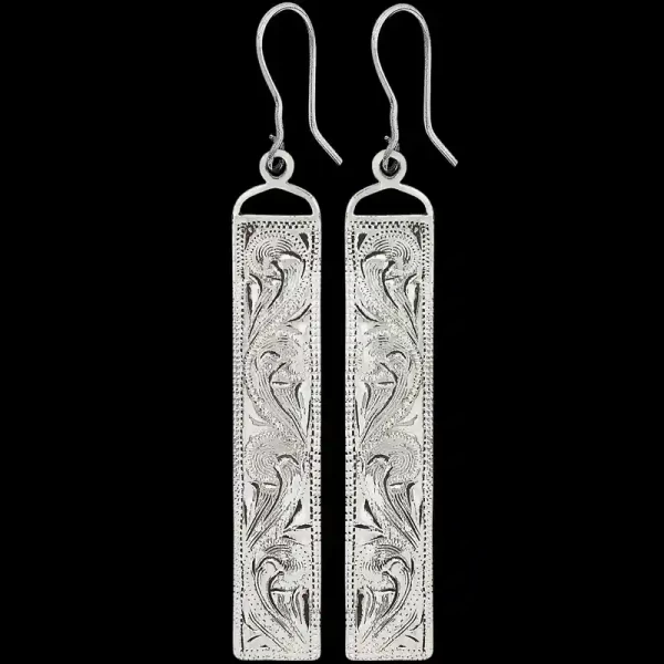 The Sagebrush Earrings add a simple yet elegant look to any cowgirl outfit. Built on a hand engraved silver base with beautiful scrollwork on natural finish rectangular bases. Order now!